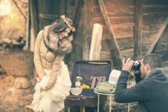 Groom photographing his bride on their wedding day